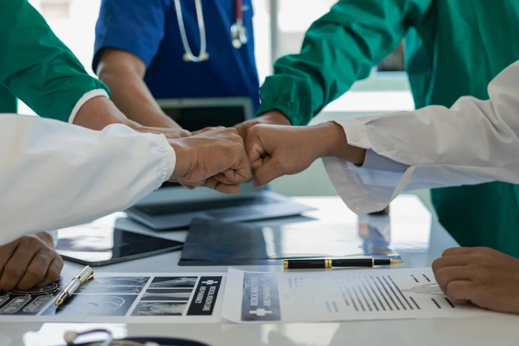 doctors and surgeons fist bumping